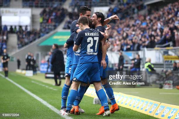 Nico Schulz of Hoffenheim celebrates with his team after he scored a goal to make it 1:0 during the Bundesliga match between TSG 1899 Hoffenheim and...