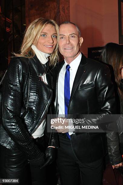 French designer Jean-Claude Jitrois and Sarah Marshall pose as they arrive at the Petit Palais museum, on November 9, 2009 in Paris, for the UNICEF...