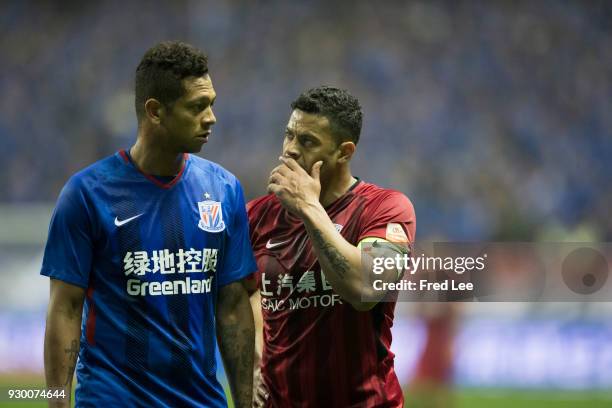 Hulk of Shanghai SIPG and Fredy Guarin of Shanghai Greenland Shenhua in action during the 2018 Chinese Super League match between Shanghai Greenland...