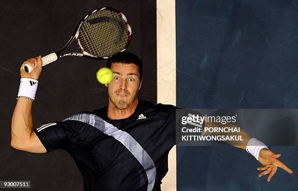 Marat Safin of Russia prepares serves to Swiss player Macro Chiudinelli during their second round of ATP Thailand Open tennis match in Bangkok on...