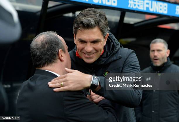 Rafael Benitez, Manager of Newcastle United and Mauricio Pellegrino, Manager of Southampton embrace prior to the Premier League match between...