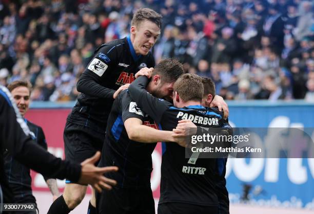 Christian Strohdiek of Paderborn jubilates with team mates after scoring the fived goal during the 3.Liga match between FC Hansa Rostock and SC...