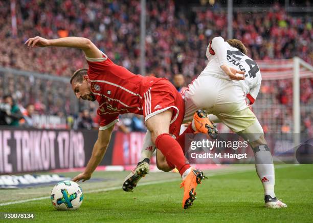 Franck Ribery of FC Bayern Muenchen is challenged by Gotoku Sakai of Hamburg during the Bundesliga match between FC Bayern Muenchen and Hamburger SV...