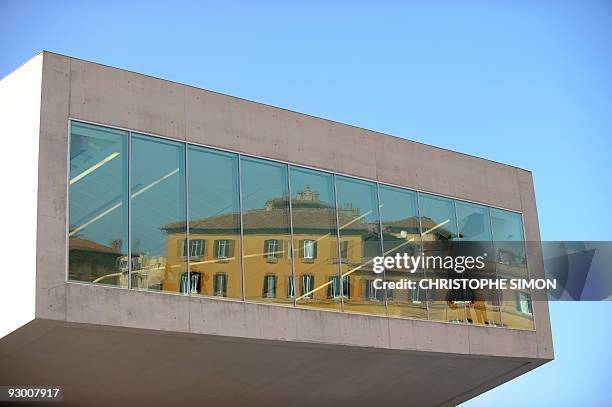 Old buildings are reflected in a window of the National Museum of the XXI Century Arts, the Maxxi, during the architectural preview on the occasion...