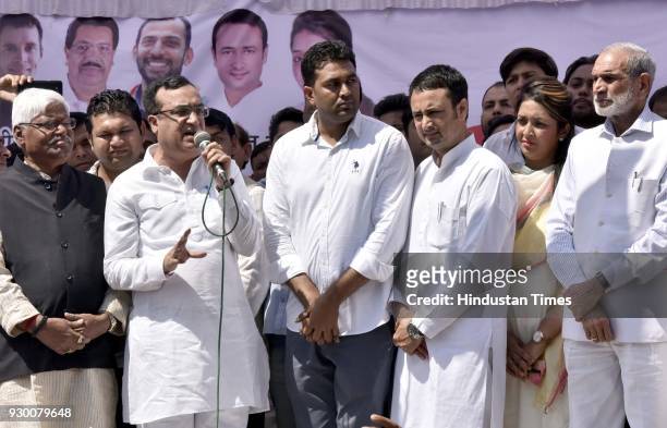 President Ajay Maken with other senior leaders addressing youth congress activist during the oath taking ceremony of the newly-elected president of...
