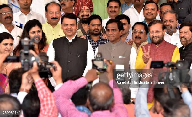 Pankaj Munde, CM Devendra Fadnavis, Roasaheb Danve, Girish Bapat along with Prakash Javadekar pose for a photograph after he filed nomination for...