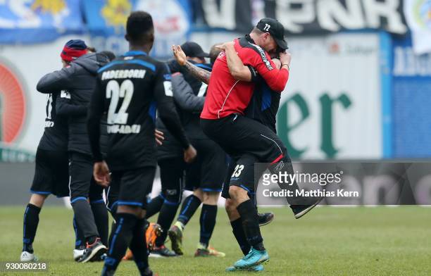 Head coach Steffen Baumgart of Paderborn and his team show their delight after winning the 3.Liga match between FC Hansa Rostock and SC Paderborn 07...