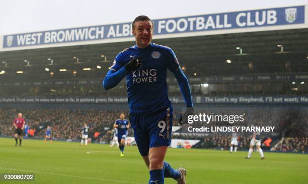 Leicester City's English striker Jamie Vardy celebrates scoring his team's first goal during the English Premier League football match between West...