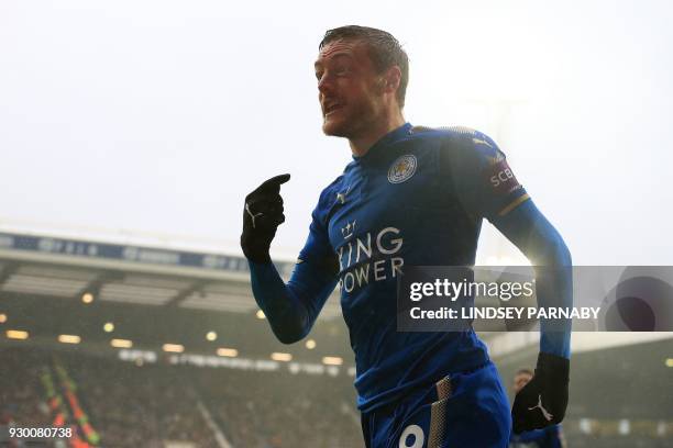 Leicester City's English striker Jamie Vardy celebrates scoring his team's first goal during the English Premier League football match between West...