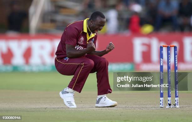 Kemar Roach of The West Indies celebrates the wicket of Kevin O'Brien of Ireland during The ICC Cricket World Cup Qualifier between The West Indies...