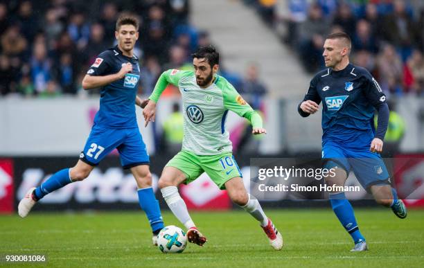 Yunus Malli of Wolfsburg is challenged by Pavel Kaderabek of Hoffenheim during the Bundesliga match between TSG 1899 Hoffenheim and VfL Wolfsburg at...