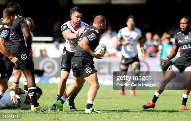 Grant Hattingh of Sunwolves tackles Akker van der Merwe of Sharks during the Super Rugby match between Cell C Sharks and Sunwolves at Jonsson Kings...