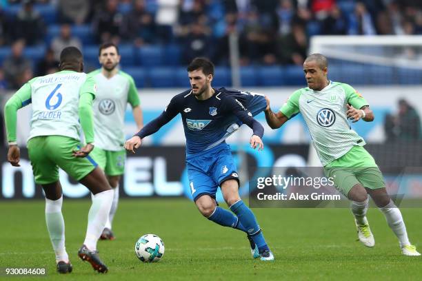 Florian Grillitsch of Hoffenheim fights for the ball with Daniel Didavi of Wolfsburg during the Bundesliga match between TSG 1899 Hoffenheim and VfL...