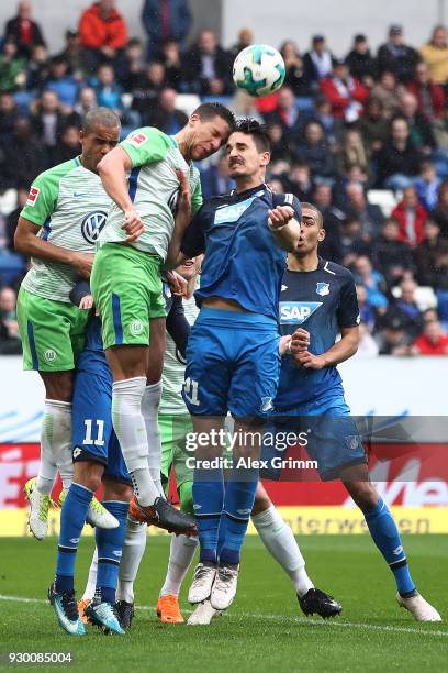 Jeffrey Bruma of Wolfsburg and Benjamin Huebner of Hoffenheim fight for the ball during the Bundesliga match between TSG 1899 Hoffenheim and VfL...