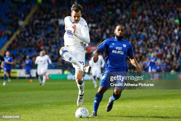 Carl Jenkinson of Birmingham City fails to clear the ball under pressure from Junior Hoilett of Cardiff City during the Sky Bet Championship match...