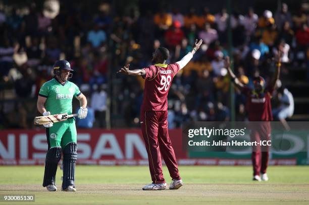 Jason Holder of The West Indies celebrates the wicket of George Dockrell of Ireland during The ICC Cricket World Cup Qualifier between The West...