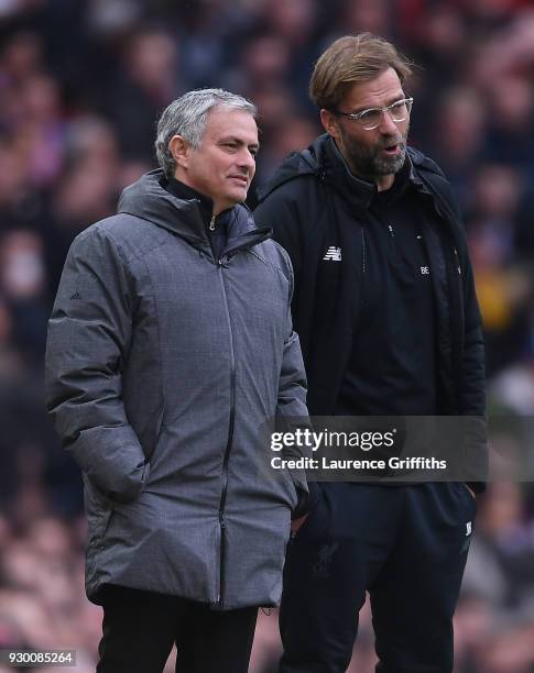 Jose Mourinho of Manchester United and Jurgen Klopp of Liverpool look on during the Premier League match between Manchester United and Liverpool at...