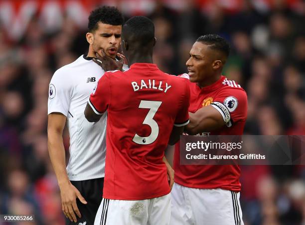 Eric Bailly of manchester United grabs the face of Dominic Solanke of Liverpool during the Premier League match between Manchester United and...