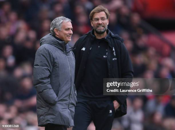 Jose Mourinho of Manchester United and Jurgen Klopp of Liverpool look on during the Premier League match between Manchester United and Liverpool at...