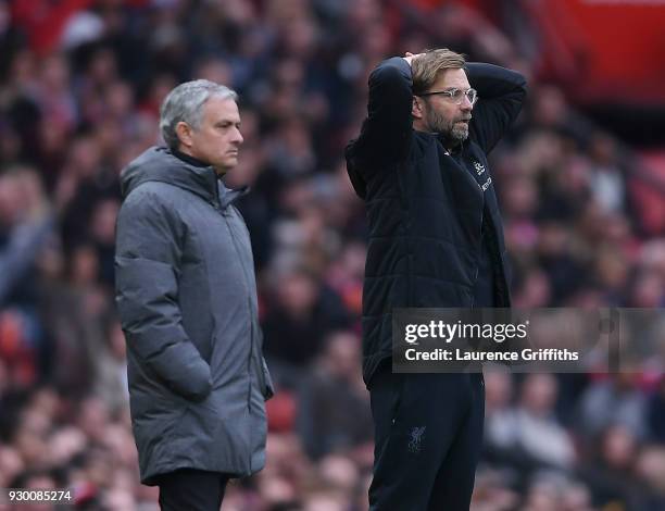 Jose Mourinho of Manchester United and Jurgen Klopp of Liverpool look on during the Premier League match between Manchester United and Liverpool at...