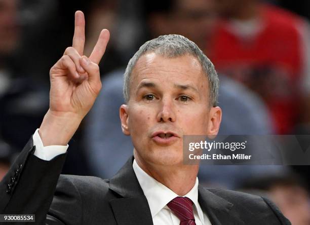 Head coach Andy Enfield of the USC Trojans signals to his players during a semifinal game of the Pac-12 basketball tournament against the Oregon...