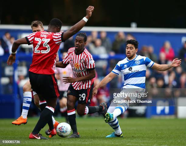 Massimo Luongo of QPR, Lamine Kone and Joel Asoro of Sunderland compete for the ball during the Sky Bet Championship match between QPR and Sunderland...