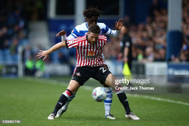 Adam Matthews of Sunderland and Eberechi Eze of QPR compete for the ball during the Sky Bet Championship match between QPR and Sunderland at Loftus...