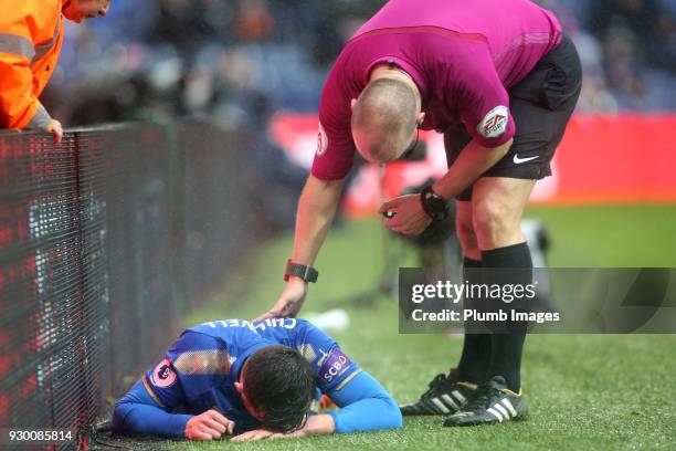 Referee Bobby Madley checks on Ben Chilwell of Leicester City after he collides with the advertising boards during the Premier League match between...