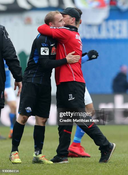 Head coach Steffen Baumgart of Paderborn and Sven Michel show their delight after winning the 3.Liga match between FC Hansa Rostock and SC Paderborn...