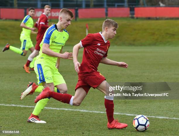 Jack Bearne of Liverpool and Louie Sibley of Derby County in action during the U18 Premier League match between Liverpool and Derby County at The...