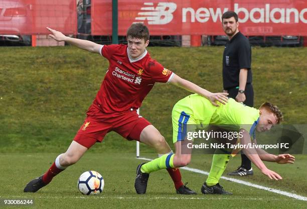 Morgan Boyes of Liverpool and Connor Dixon of Derby County in action during the U18 Premier League match between Liverpool and Derby County at The...