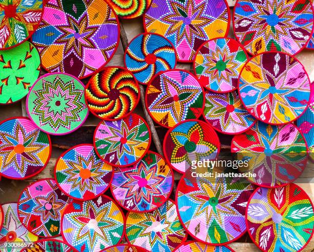 multi-colored baskets in a market, axum, ethiopia - african textiles stockfoto's en -beelden
