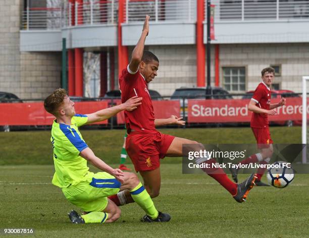 Elijah Dixon-Bonner of Liverpool and Connor Dixon of Derby County in action during the U18 Premier League match between Liverpool and Derby County at...