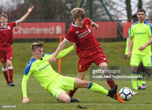 Jake Cain of Liverpool and Jack Haywood of Derby County in action during the U18 Premier League match between Liverpool and Derby County at The...