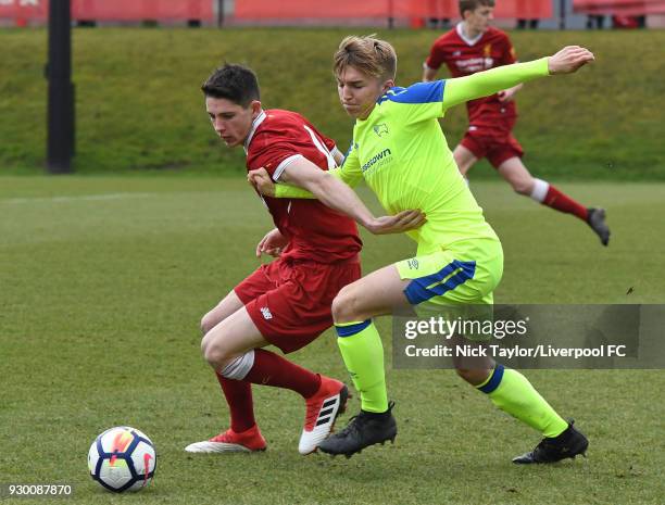 Jordan Hunter of Liverpool and Jack Haywood of Derby County in action during the U18 Premier League match between Liverpool and Derby County at The...