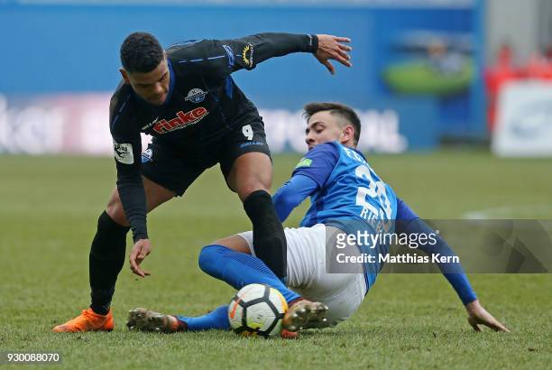 Nico Rieble of Rostock battles for the ball with Kwame Yeboah of Paderborn during the 3.Liga match between FC Hansa Rostock and SC Paderborn 07 at...