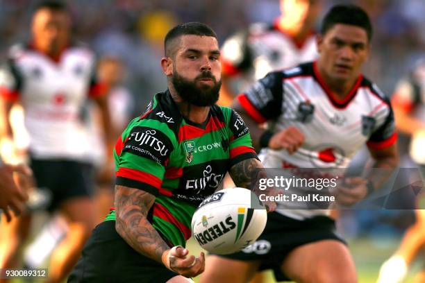 Adam Reynolds of the Rabbitohs passes the ball during the round one NRL match between the South Sydney Rabbitohs and the New Zealand Warriors at...