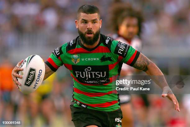 Adam Reynolds of the Rabbitohs runs the ball during the round one NRL match between the South Sydney Rabbitohs and the New Zealand Warriors at Optus...