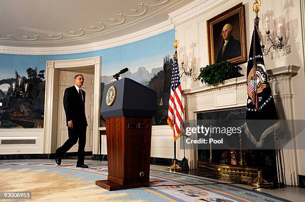 President Barack Obama walks to the podium before making a statement to the press on the economy in the Diplomatic Reception Room at the White House...