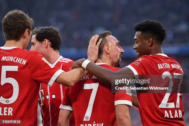 Franck Ribery of Bayern Muenchen celebrates with David Alaba of Bayern Muenchen and other players, after he scored a goal to make it 5:0 during the...