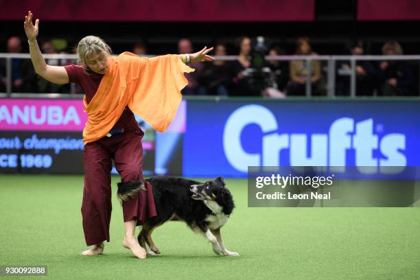 Barbara Cristallini and "Dana" stage a "Free Tibet" protest performance as they take part in the Heelwork to Music competition on day three of the...
