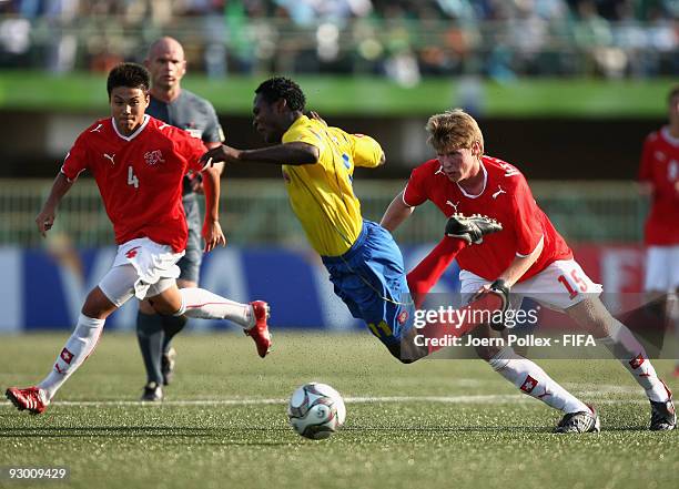 Charyl Chappuis and Sead Hajrovic of Switzerland and Wilson Cuero of Colombia battle for the ball during the FIFA U17 World Cup Semi Final match...