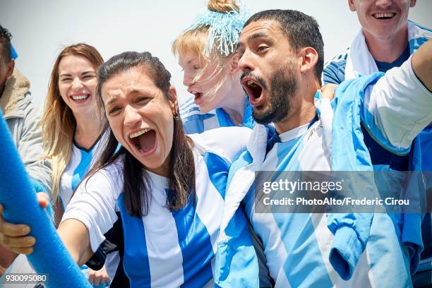 argentinian football fans watching football match - female football fans stock pictures, royalty-free photos & images