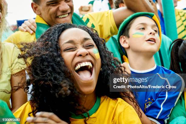 brazilian football fans watching football match - fan women stock pictures, royalty-free photos & images