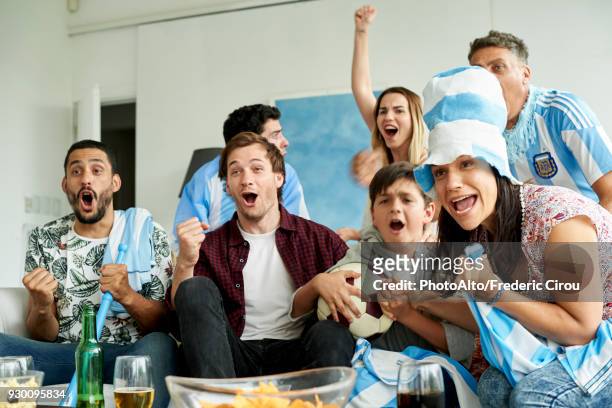 argentinian football fans watching football match at home - anticipation excited stock pictures, royalty-free photos & images