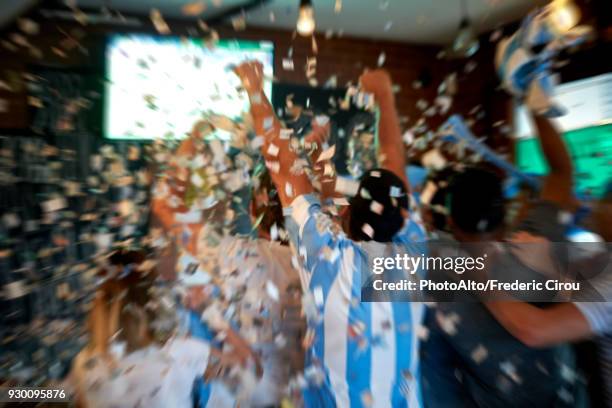 argentinian football fans watching football match at sports bar - argentina soccer imagens e fotografias de stock