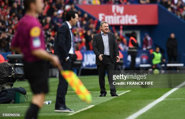 Metz's head coach Frederic Hantz gestures during the French Ligue 1 football match between Paris Saint-Germain and Metz at the Parc des Princes...