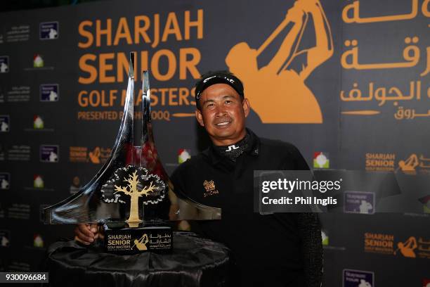 Thaworn Wiratchant of Thailand poses with the trophy after the final round of the Sharjah Senior Golf Masters presented by Shurooq played at Sharjah...