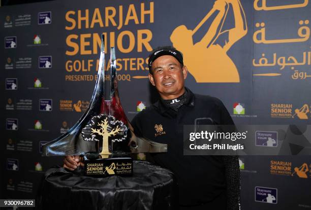 Thaworn Wiratchant of Thailand poses with the trophy after the final round of the Sharjah Senior Golf Masters presented by Shurooq played at Sharjah...