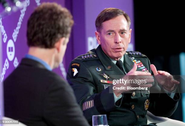 Army General David Petraeus, head of U.S. Central Command, right, speaks to Michael O'Hanlon, director of research and senior fellow in foreign...